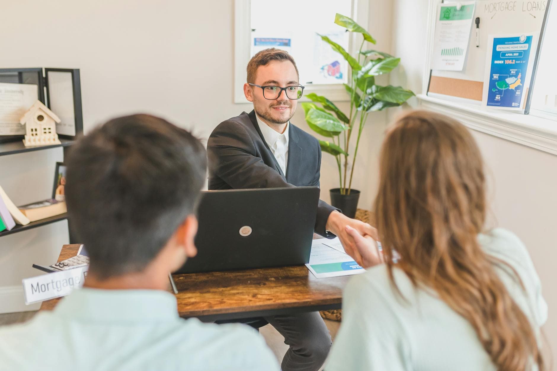 Business professional reviewing automation ROI calculations with consultant